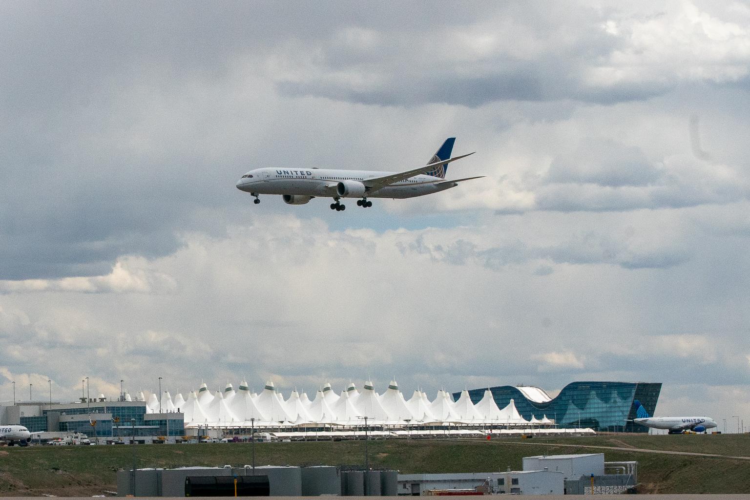 A United Airlines passenger jet approaches Denver International Airport for landing