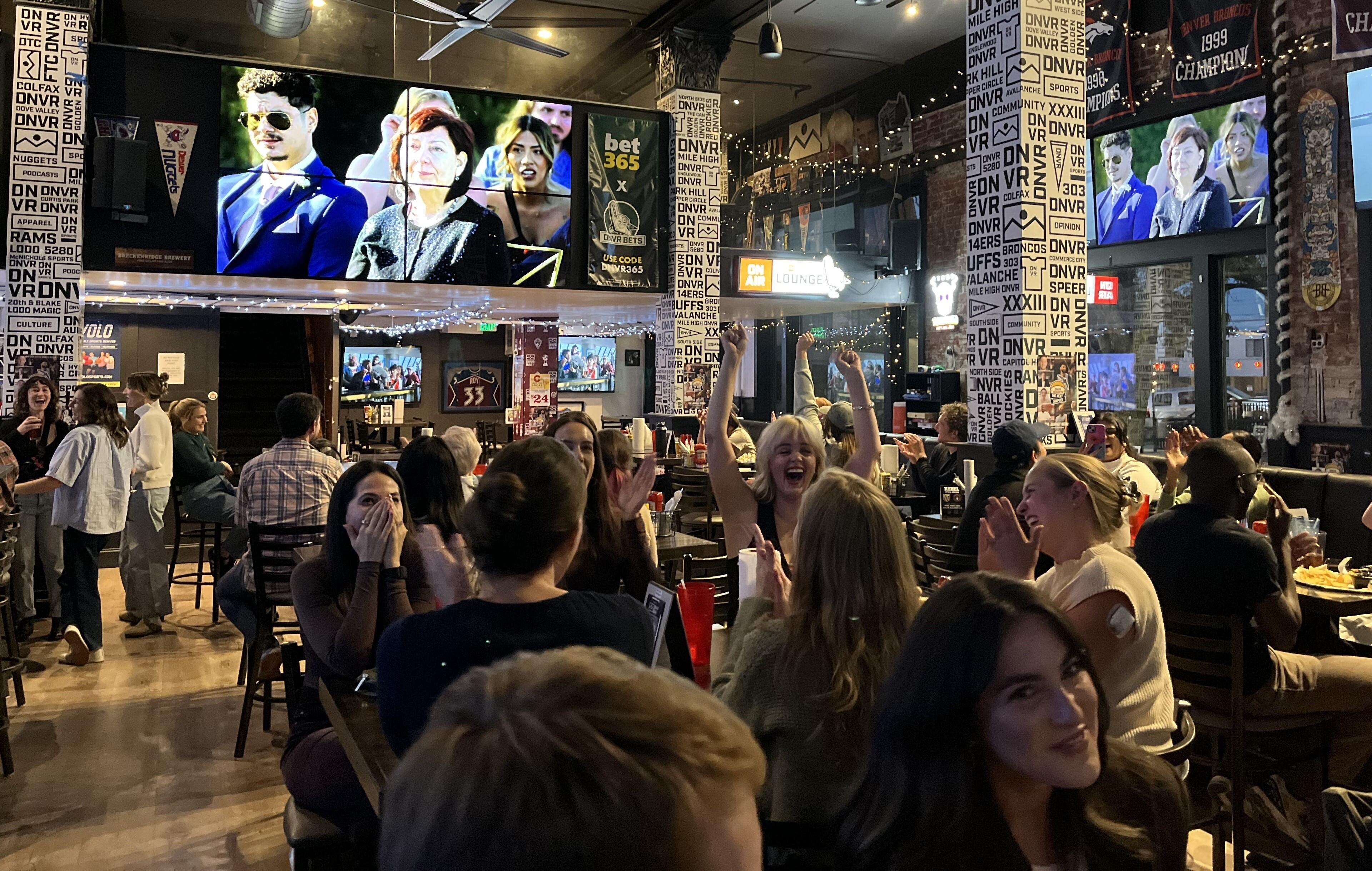 Tables full of locals are watching the season finale of hit reality television show Love Is Blind at DNVR, a Denver bar, on Wednesday, October 22, 2025. Bars across the city held watch parties for the show's latest season, which was shot in Denver.