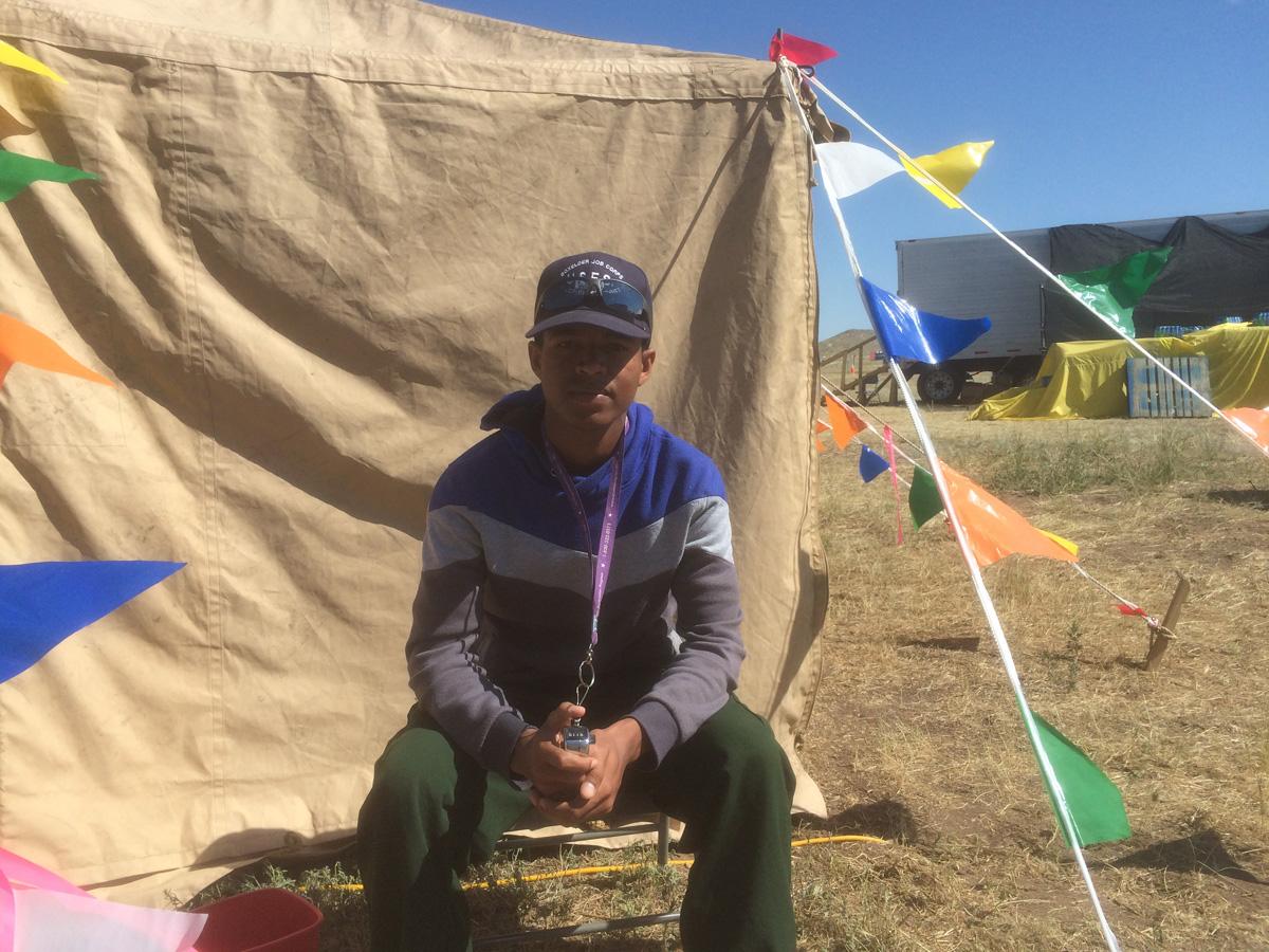 19-year-old Yonas Amine takes a break while working in the Hayden Pass Fire base camp.