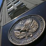 FILE - In this June 21, 2013, file photo, the seal a fixed to the front of the Department of Veterans Affairs building in Washington. The Republican-led House on March 16, 2017, has approved legislation to make it easier for the Department of Veterans Affairs to fire, suspend or demote employees for poor performance or bad conduct, part of a renewed effort targeting VA accountability in the new Trump administration. (AP Photo/Charles Dharapak, File)
