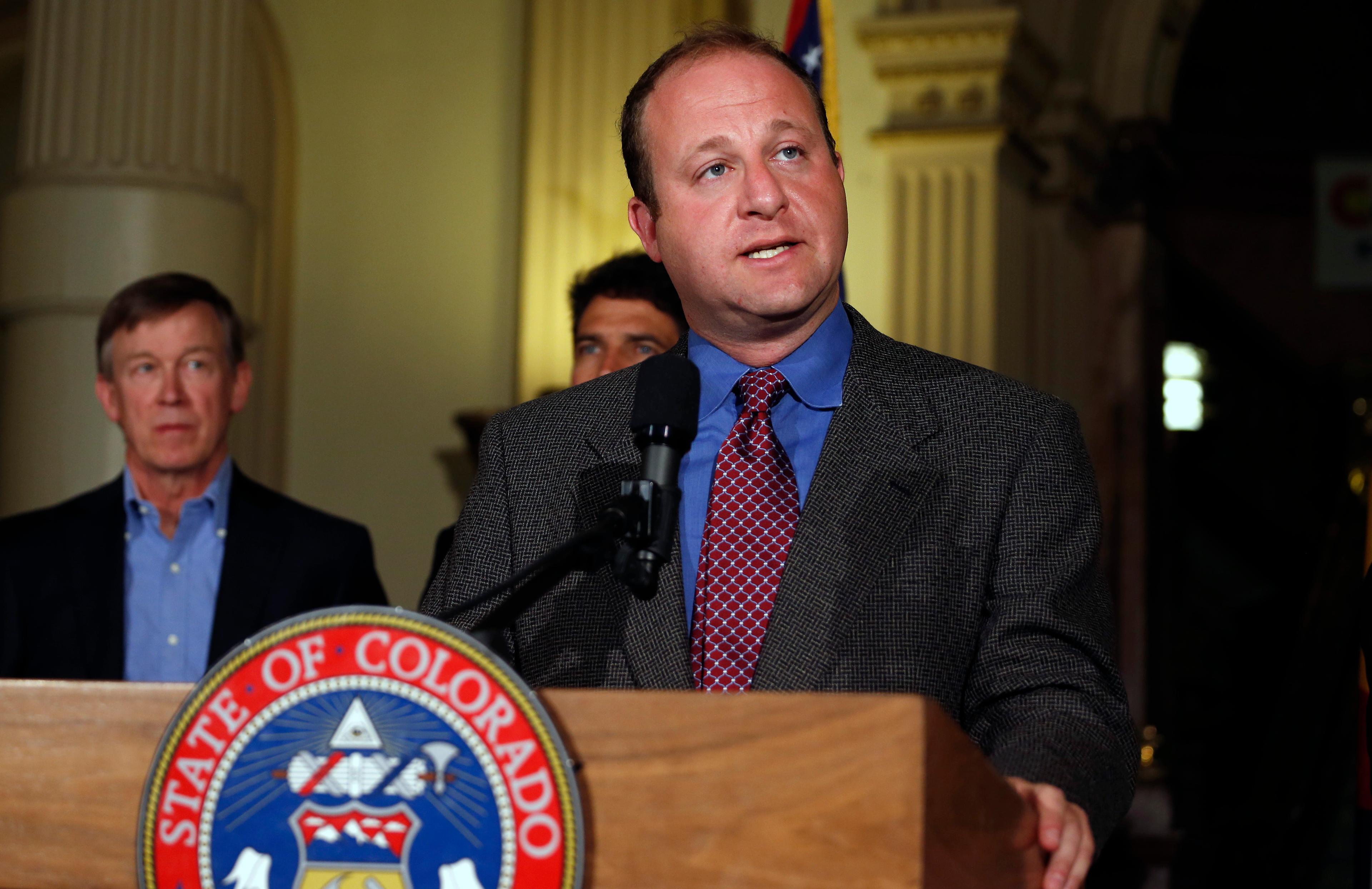 Photo: Polis, Hickenlooper (AP Photo)