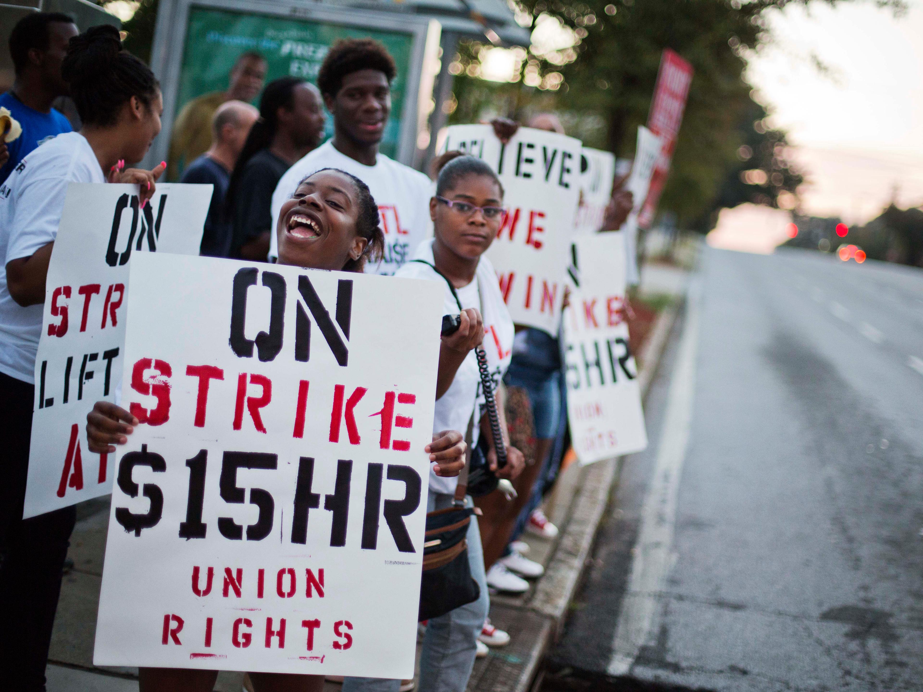 Photo: Protesting minimum wage (AP Photo)