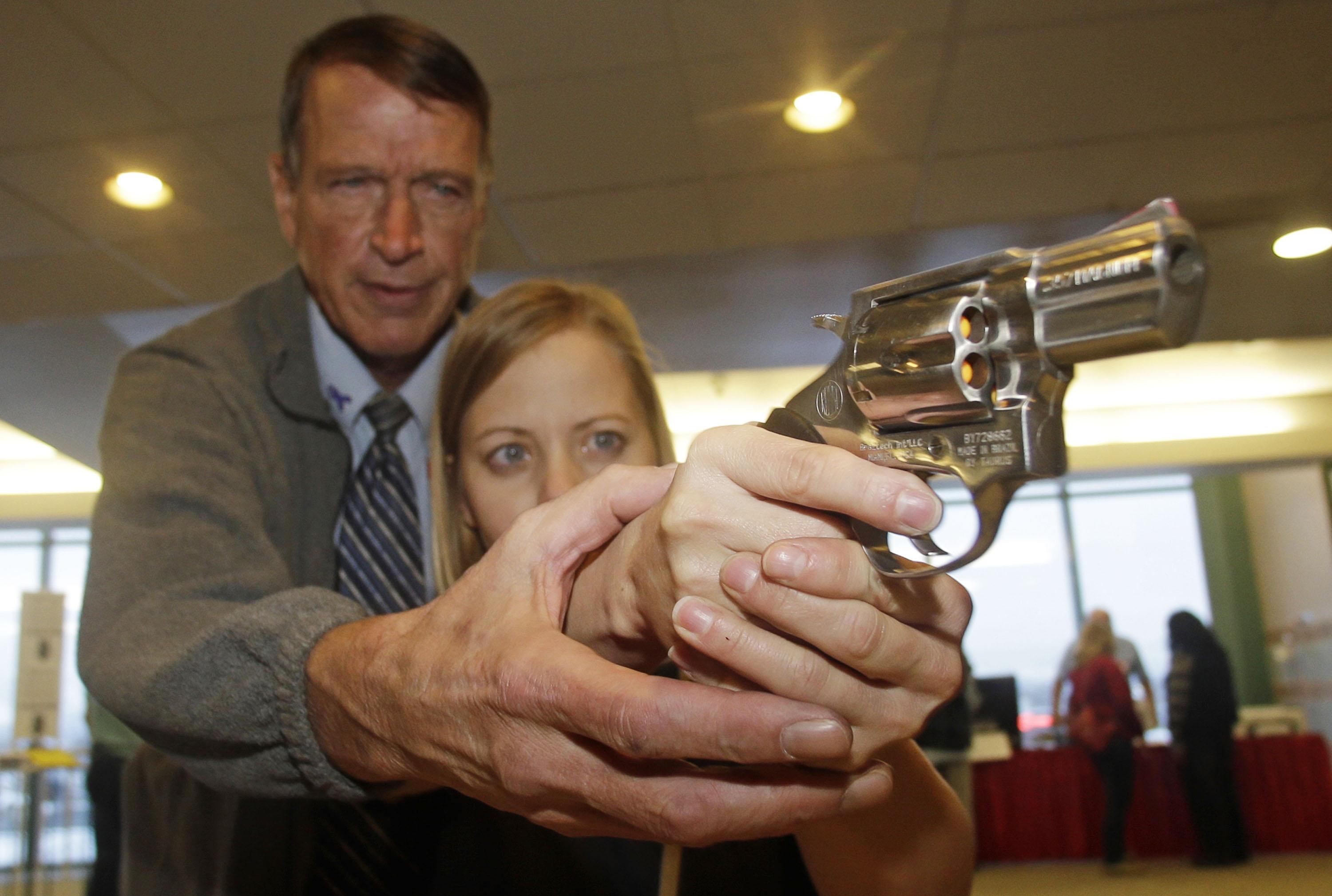 Photo: Teacher with gun (AP Photo)