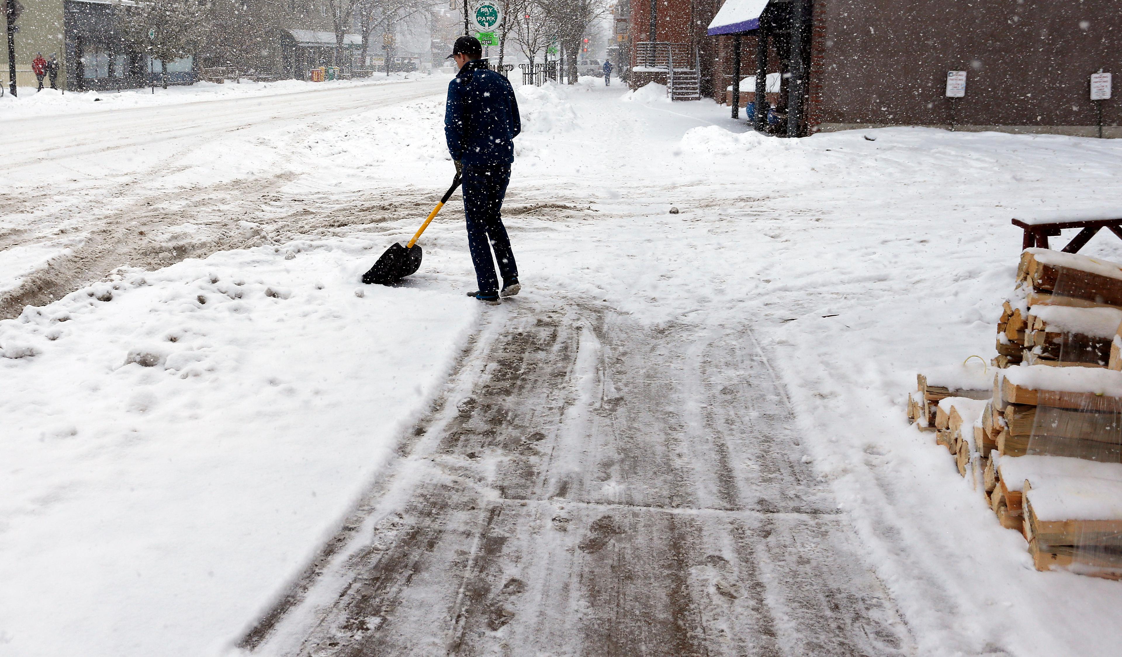Photo: Shoveling snow in Boulder (AP Photo)