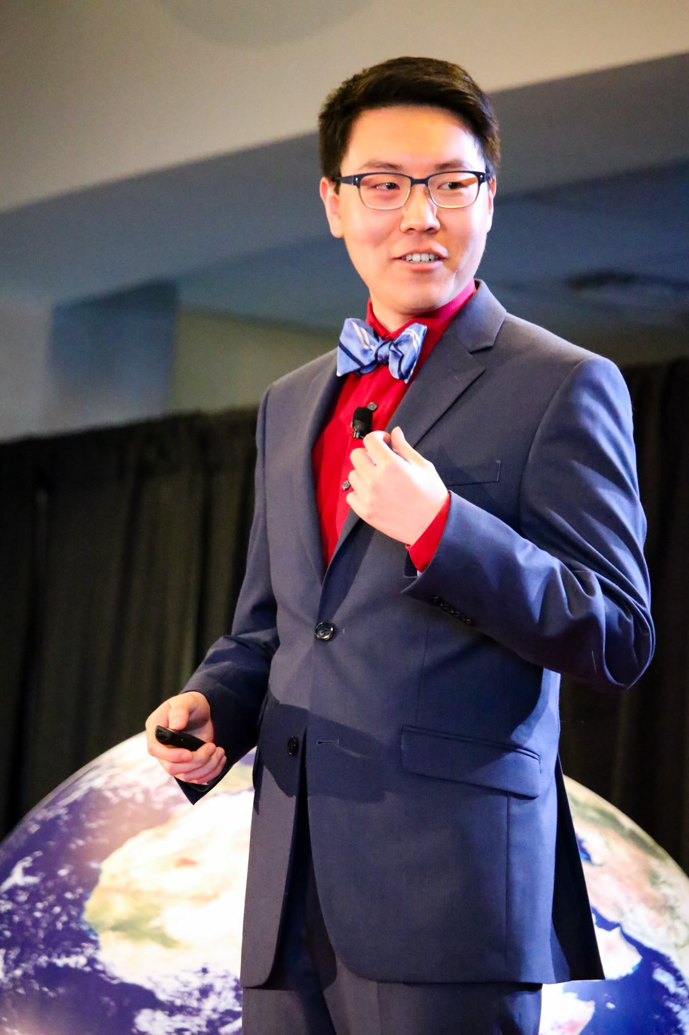 Photo: Boulder video game developer Zhenghua Yang speaks at TEDxCU