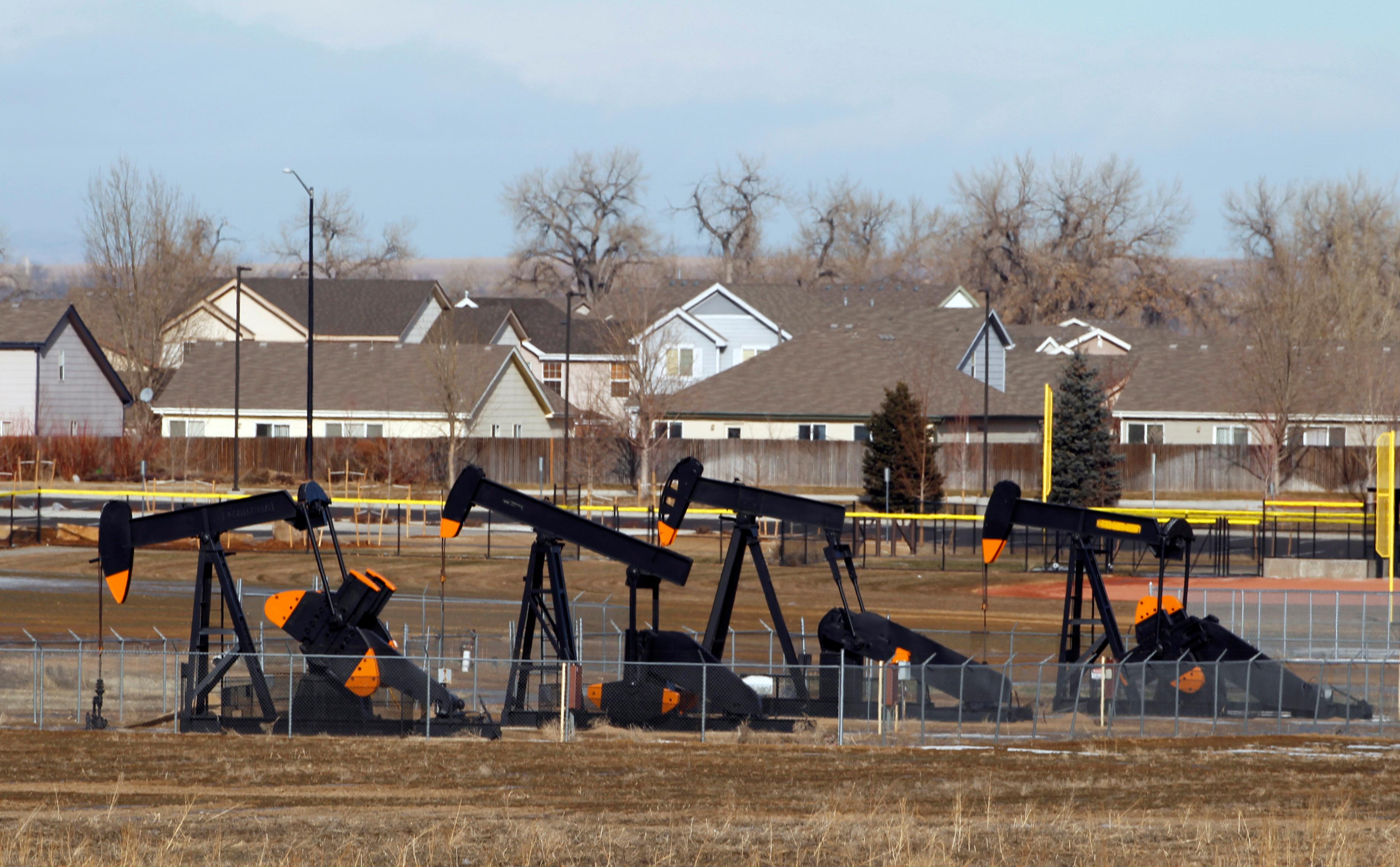 Photo: Drilling near homes in suburban Denver (AP Photo)