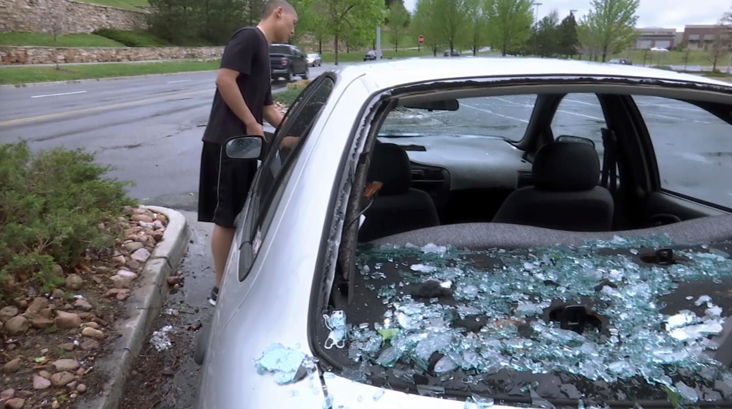 Photo: Car Hail Damage - AP Photo