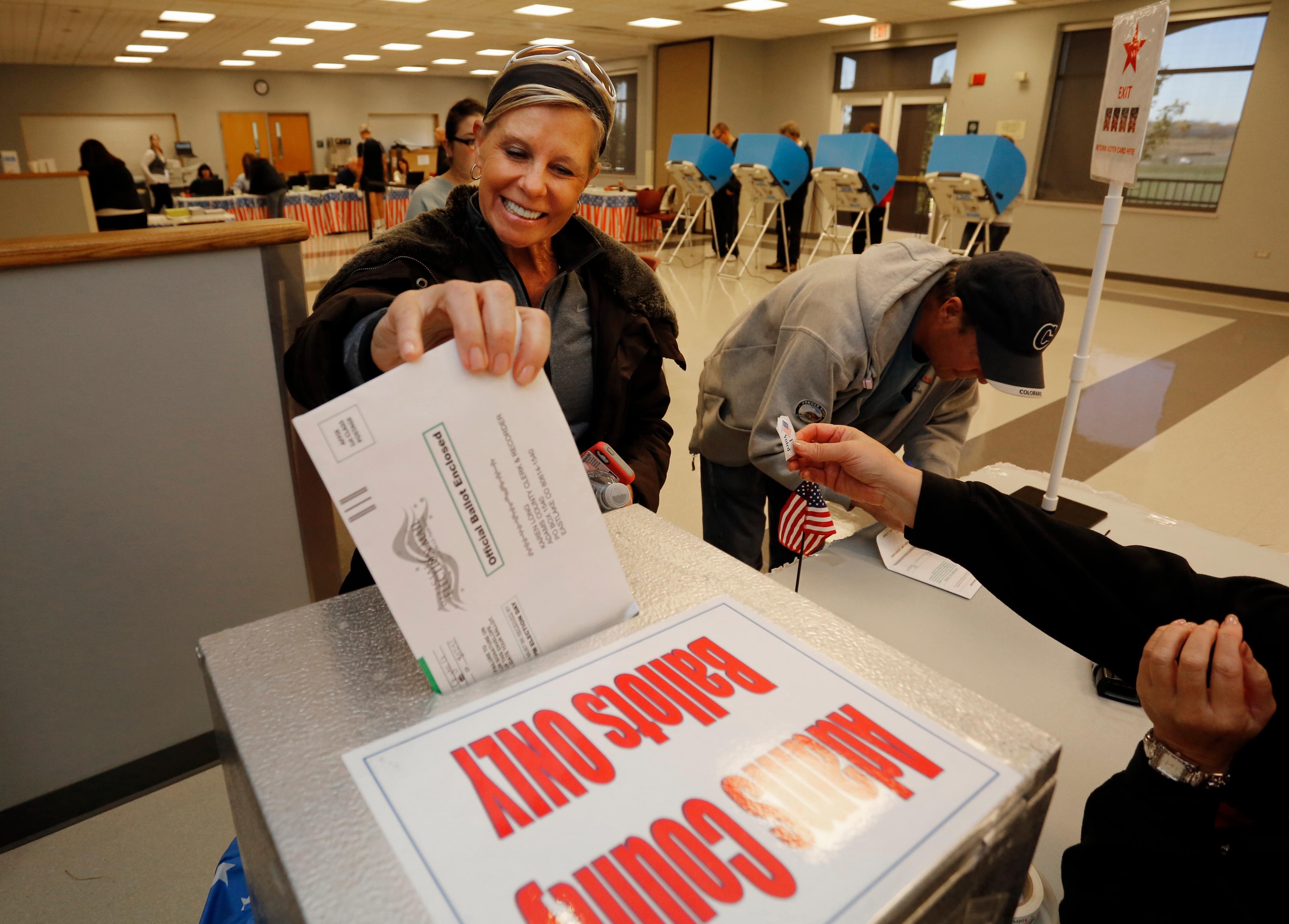 Photo: Voter casts ballot (AP Photo)