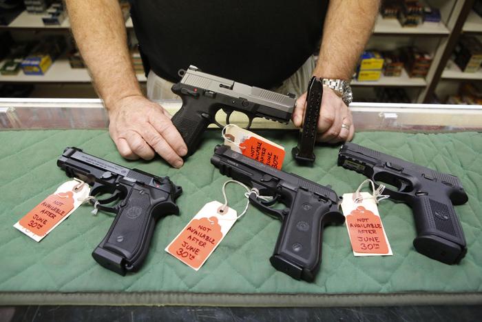 Photo: Guns for sale in Aurora (AP Photo)