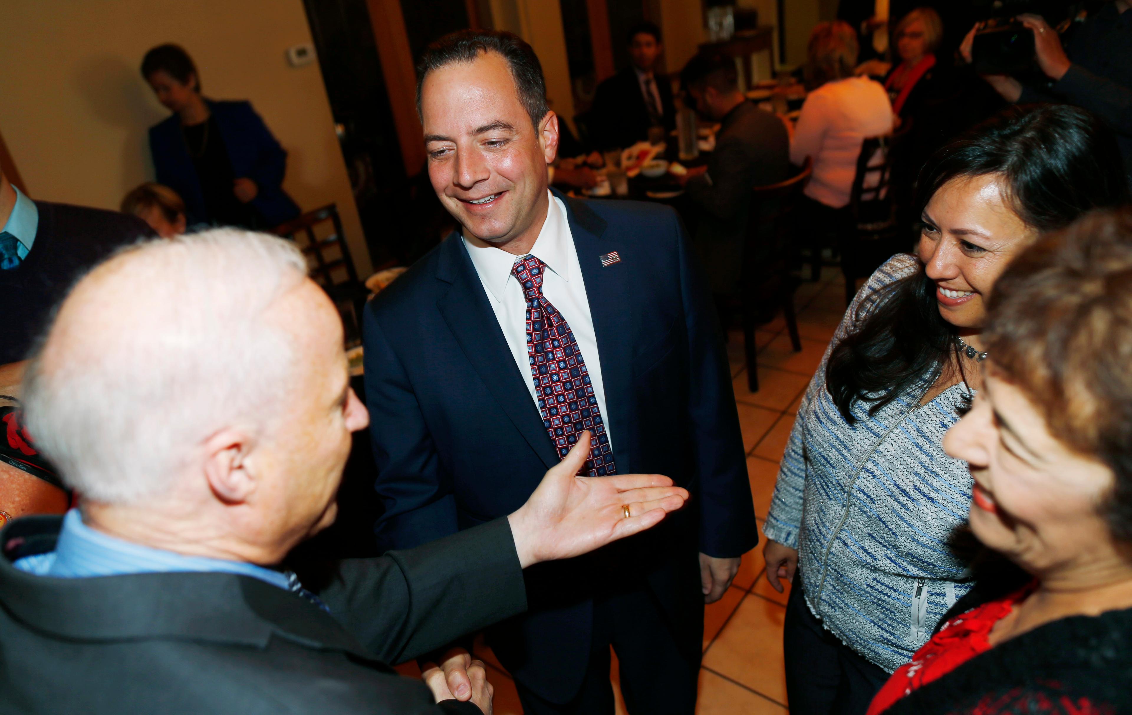 Photo: Reince Priebus, Mike Coffman at Mexican restaurant (AP Photo)