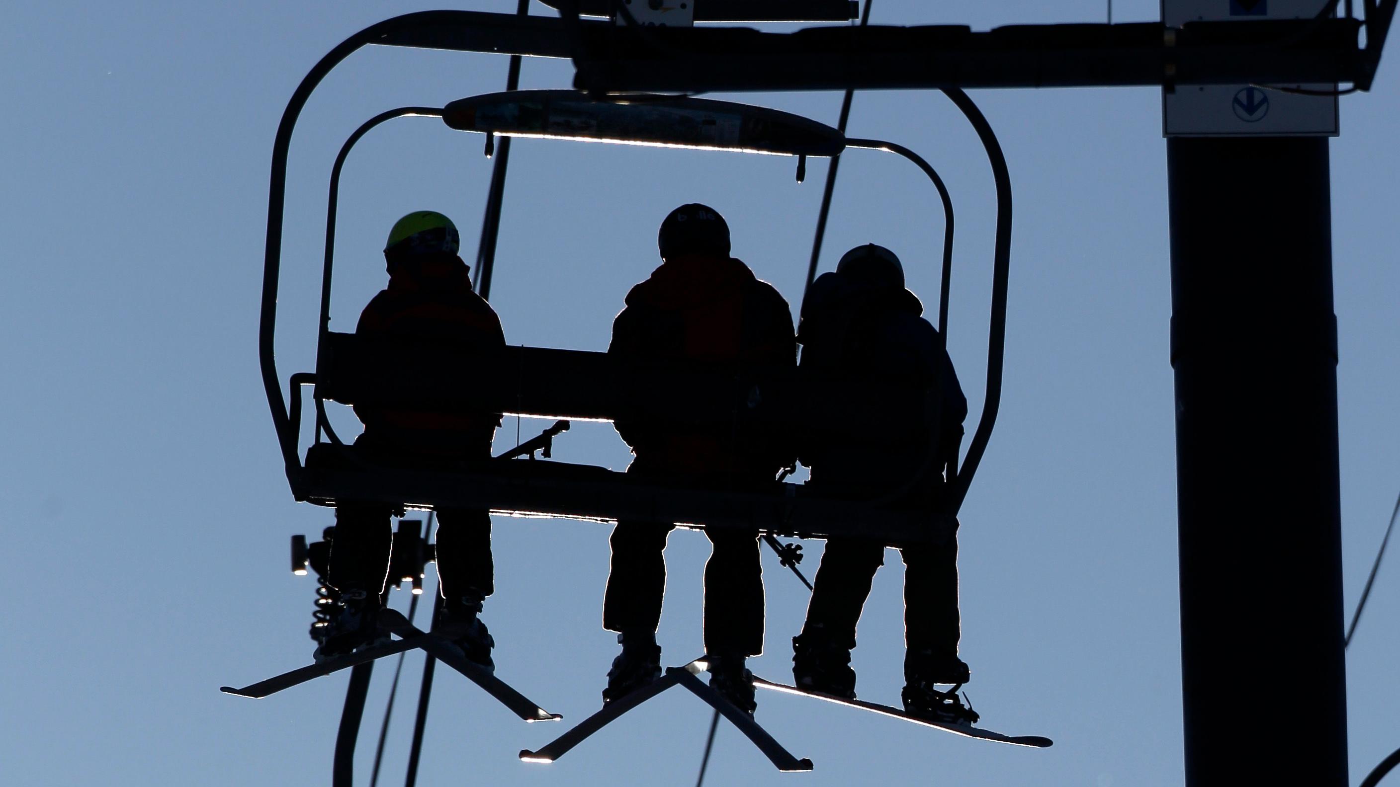 Photo: Skiers on lift (AP/file)