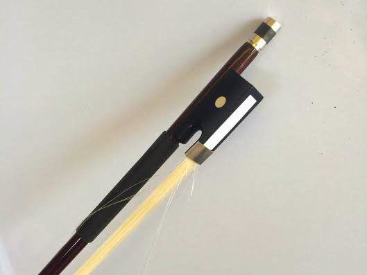 Photo: Violin bow, with loose hair