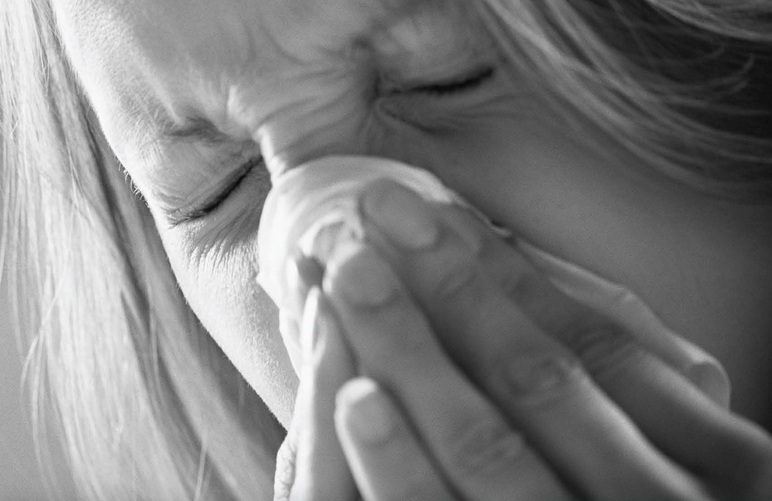 photo: Woman blowing nose