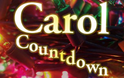 Close up of Christmas lights with the words Carol Countdown