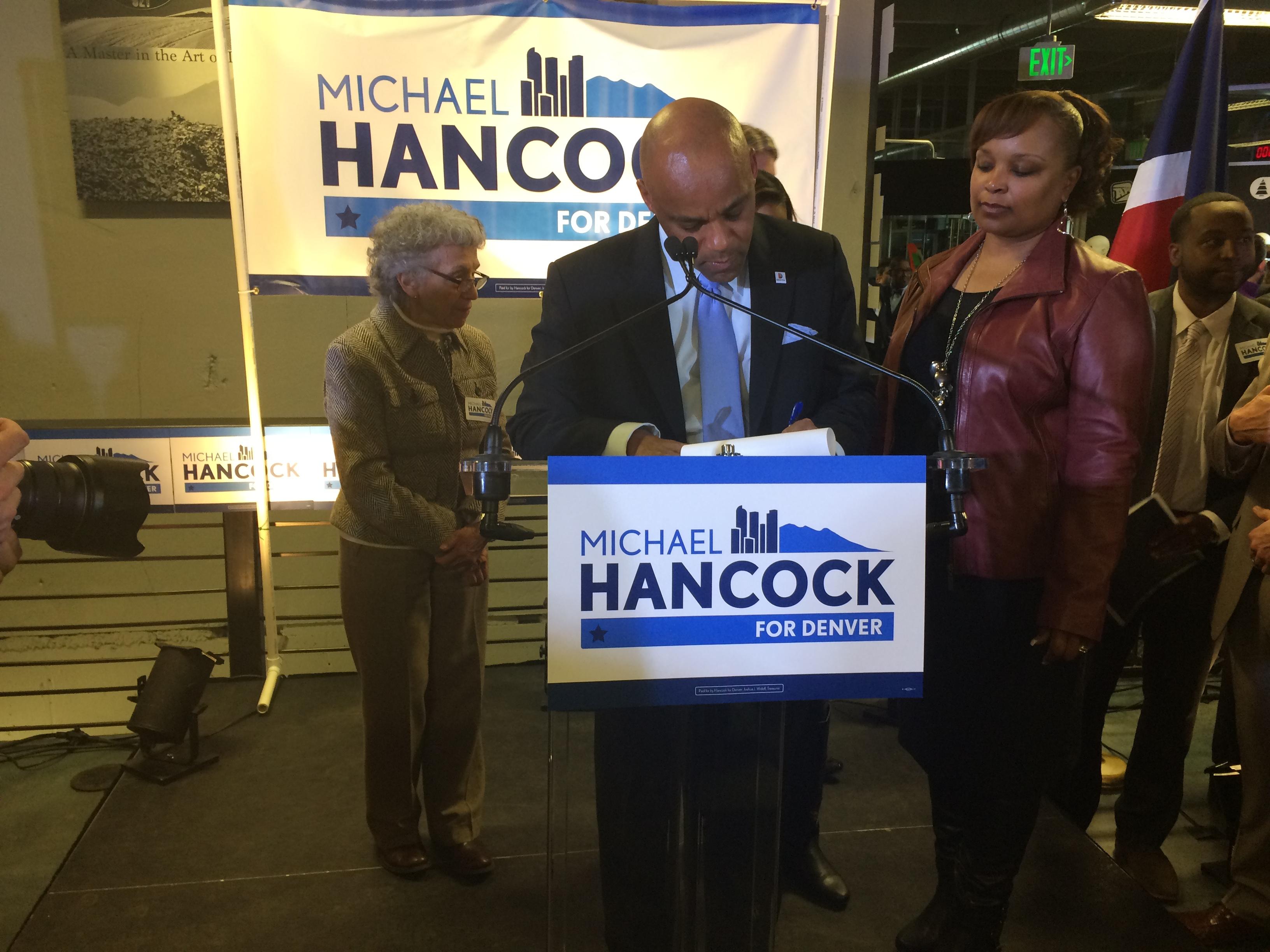 Photo: Denver mayor Michael Hancock signs petition