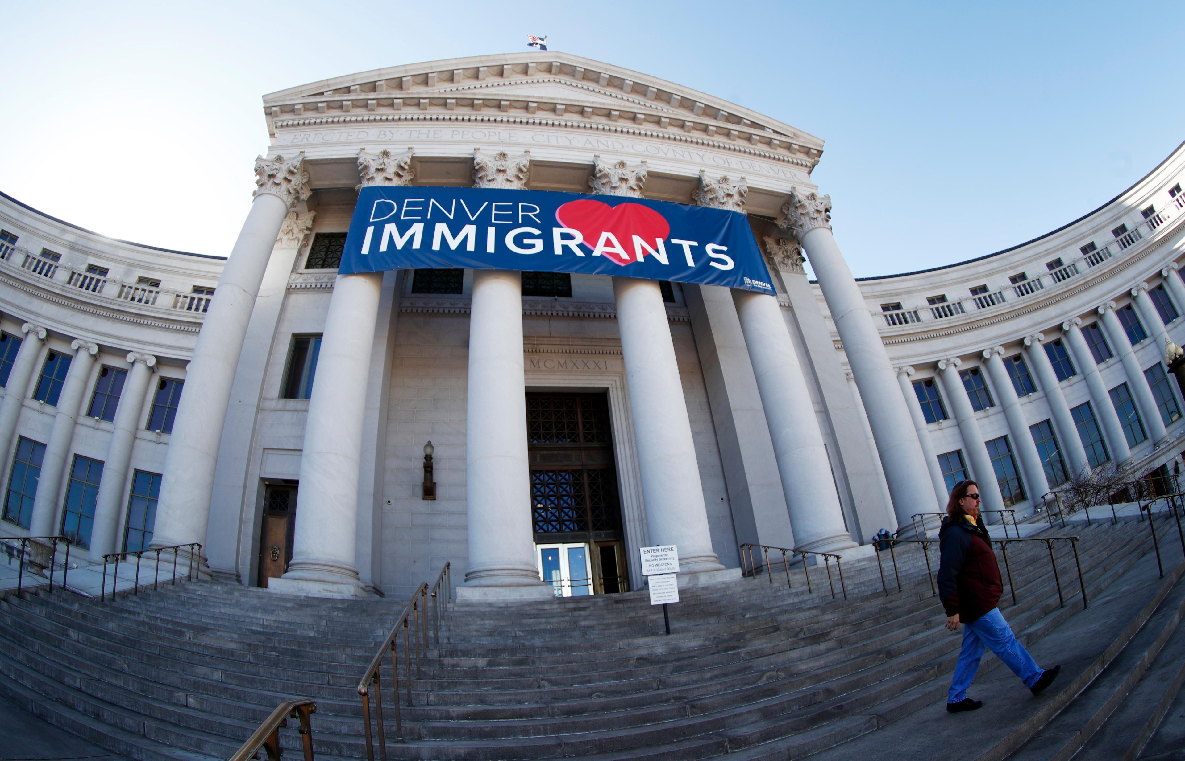 Immigrant Welcome Banner over steps of Denver City and County Building