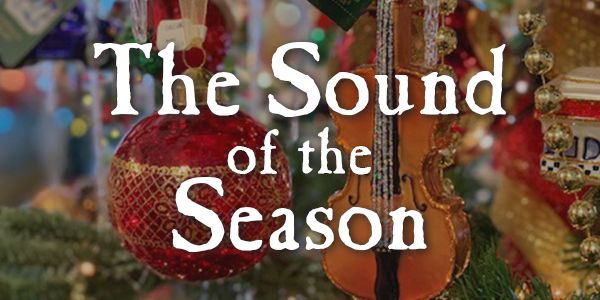 Close up of Christmas tree ornaments with the words "The Sound of the Season"