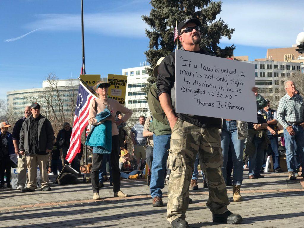 A man attend a gun rights rally at the Colorado State Capitol on Saturday, Dec. 7, 2019.