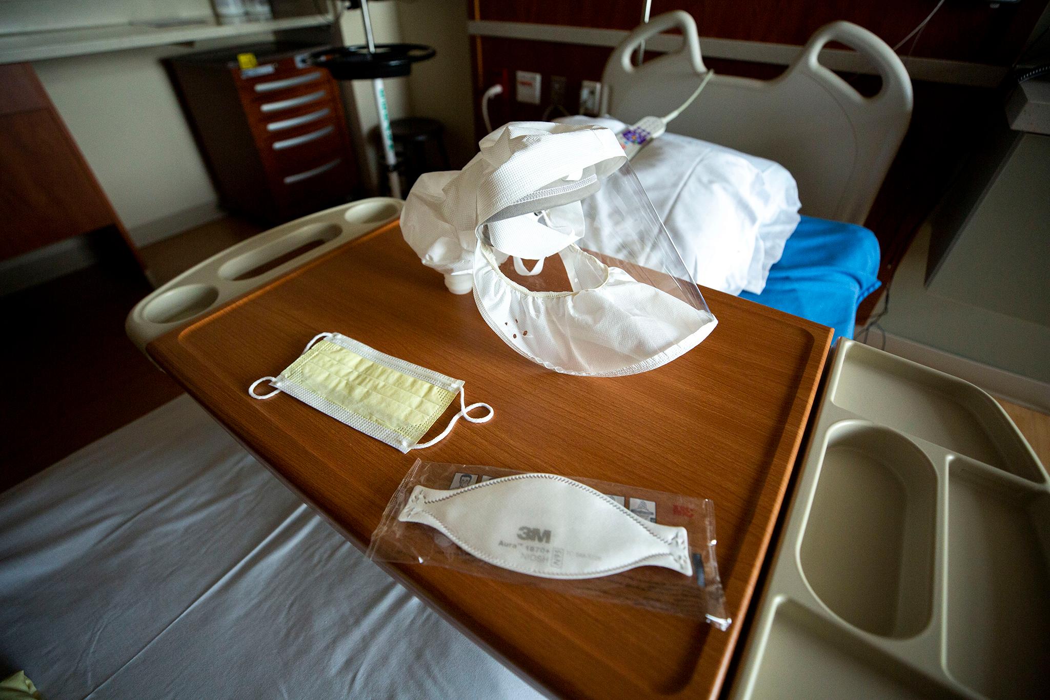 An array of medical masks on a bed at St. Joseph Hospital, March 10, 2020.