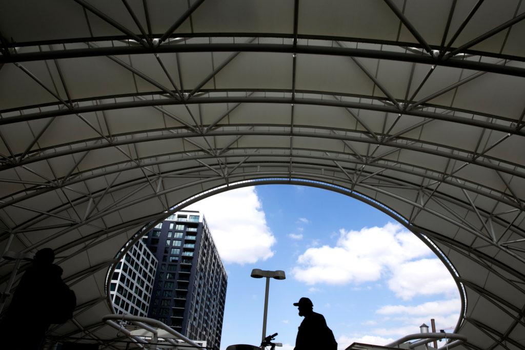 A man pushes his bicycle in Denver’s Union Station