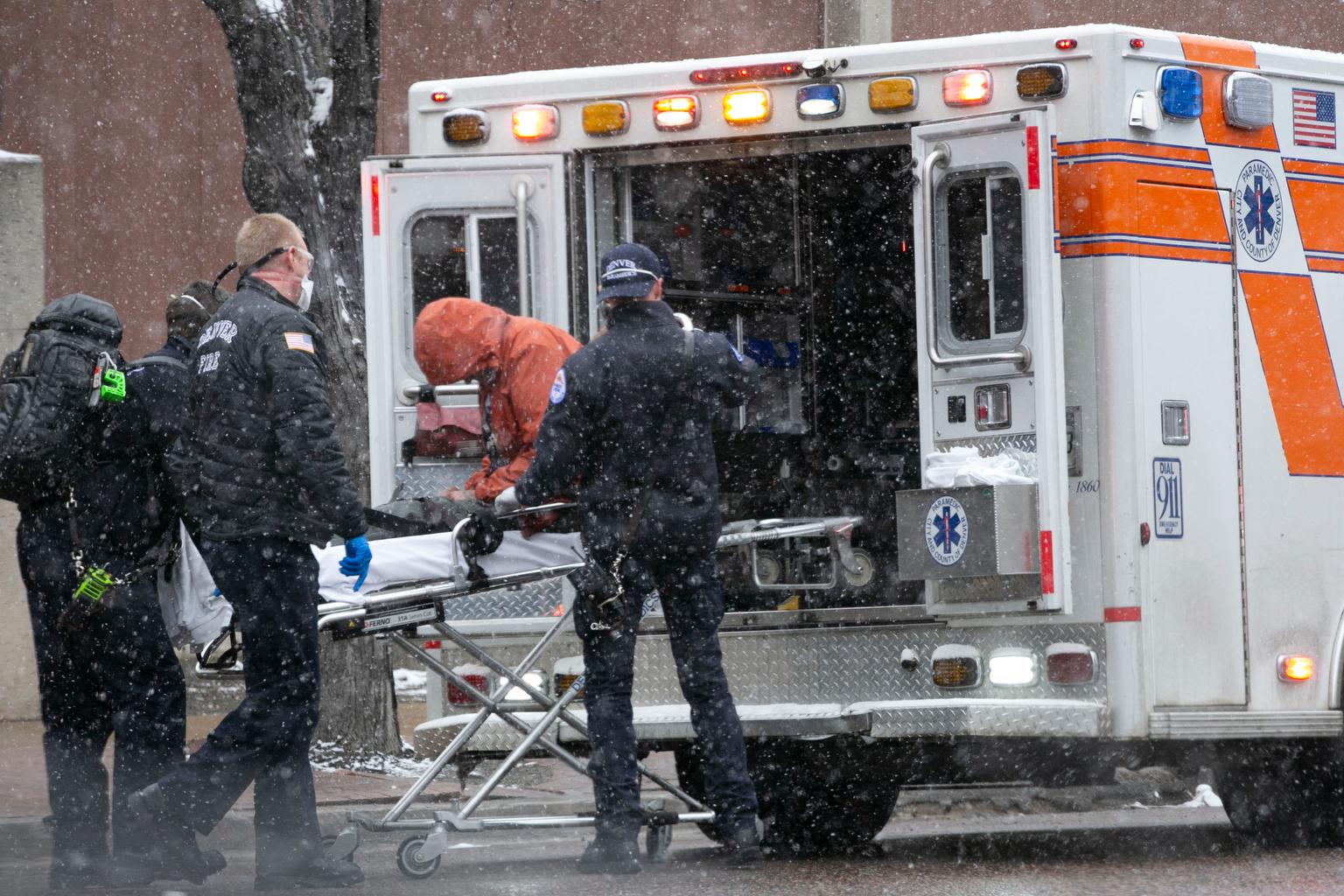 Denver Health Paramedics load a man into an ambulance