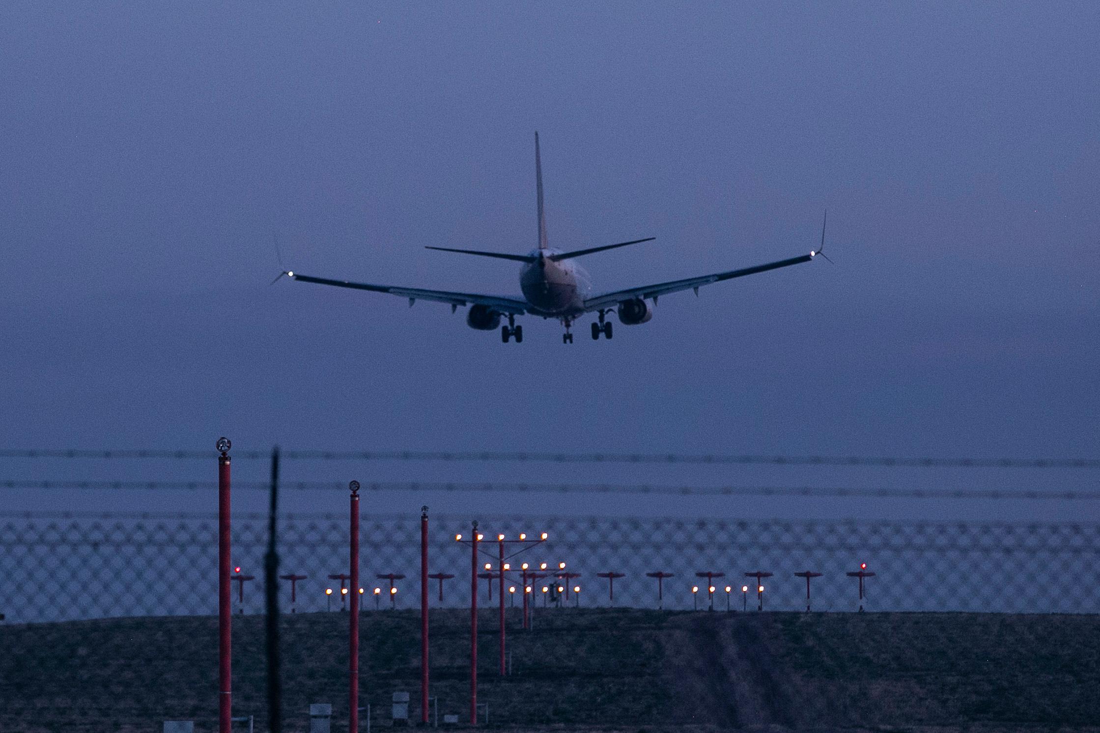 An airliner lands at Denver International Airport