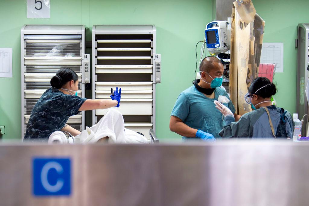 USNS Mercy Sailors Treat Patient