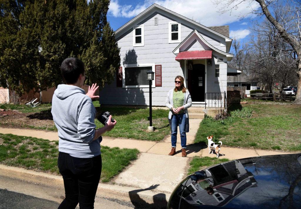 Lafayette photographer with a subject outsider her house during coronavirus