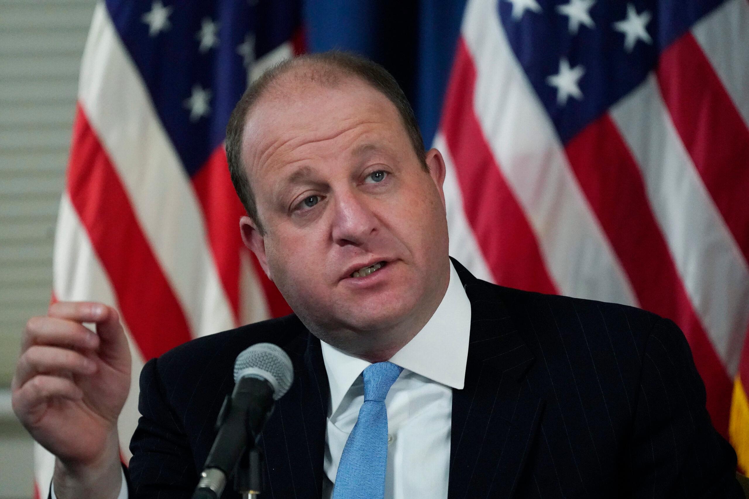 Gov. Jared Polis speaks during a news conference.