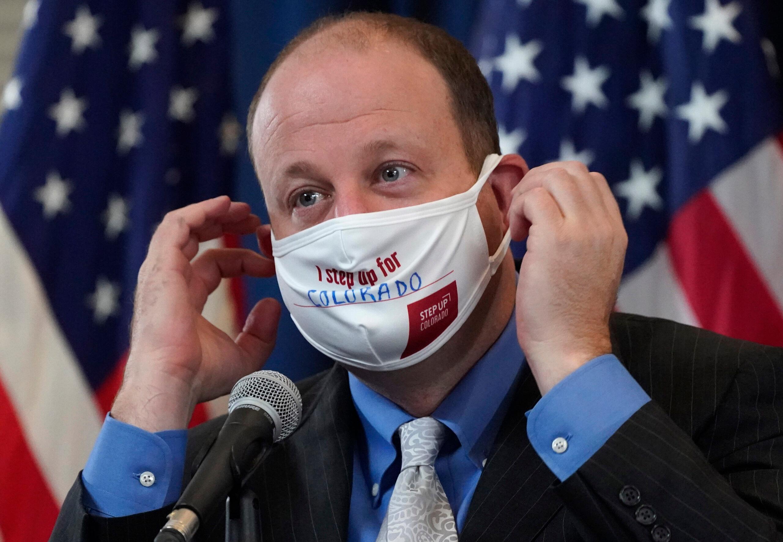 Jared Polis in a face mask.