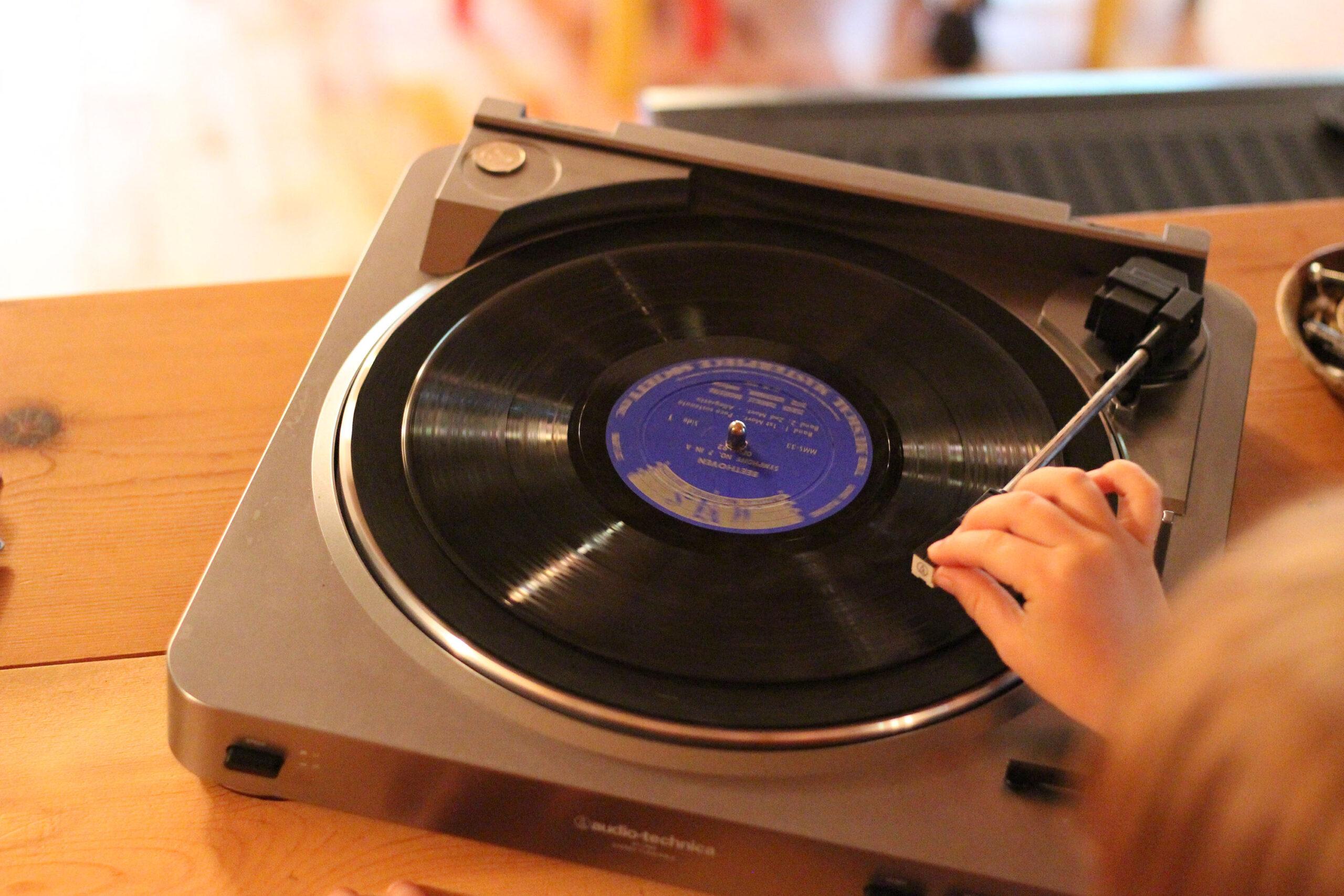 record player with child's hands music
