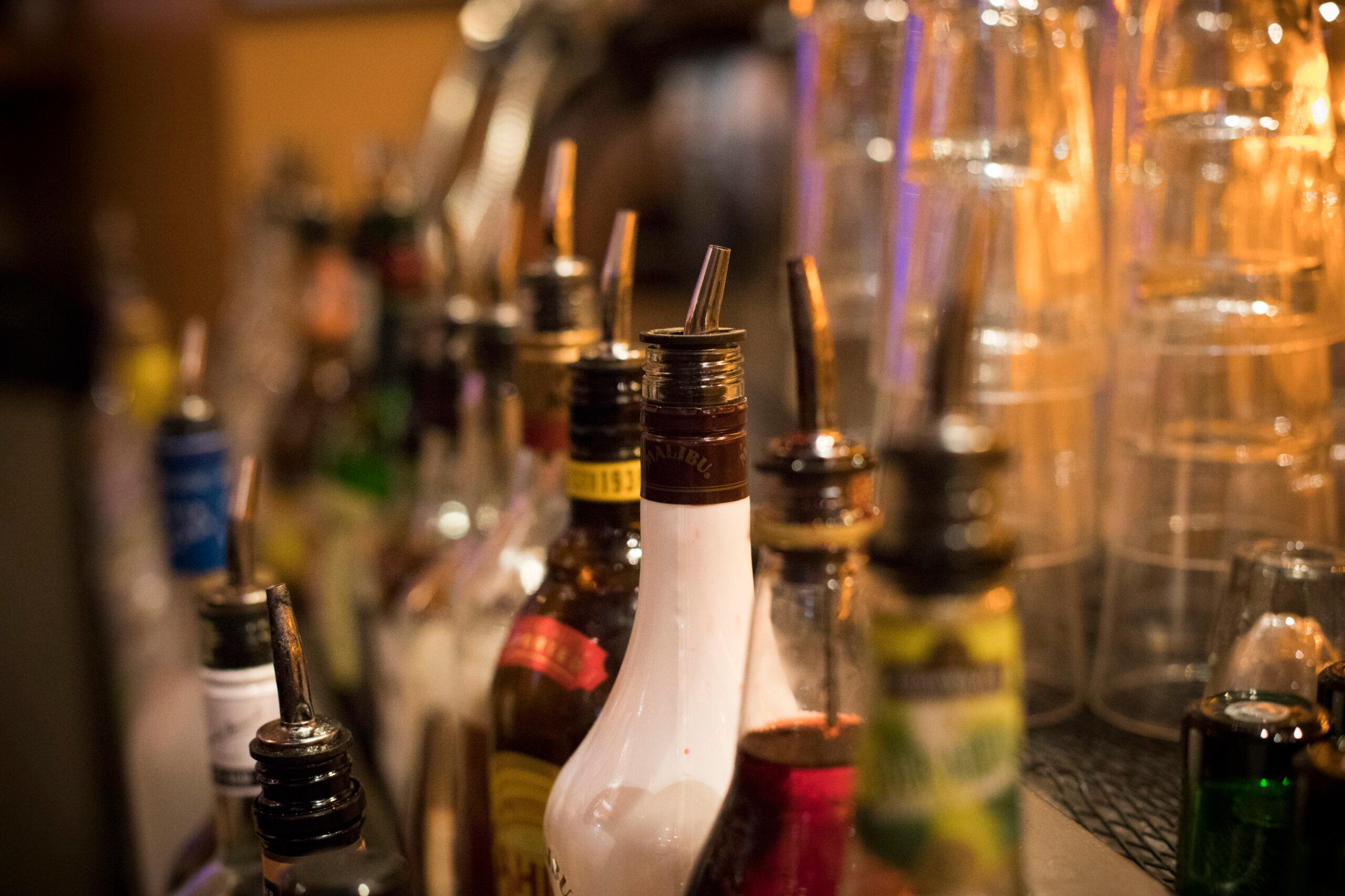 Various liquor bottles at a bar