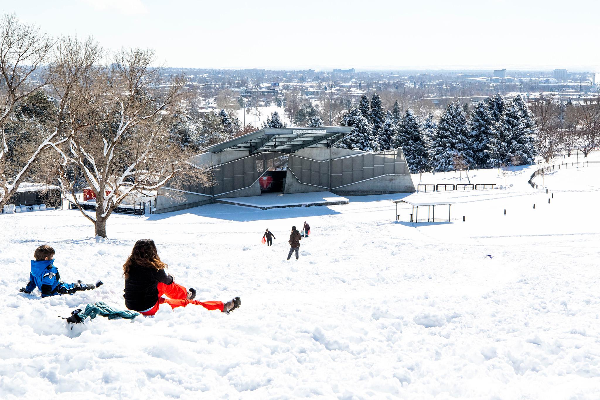 Kids sled the big hill at Ruby Hill in Denver. Feb. 25, 2021.