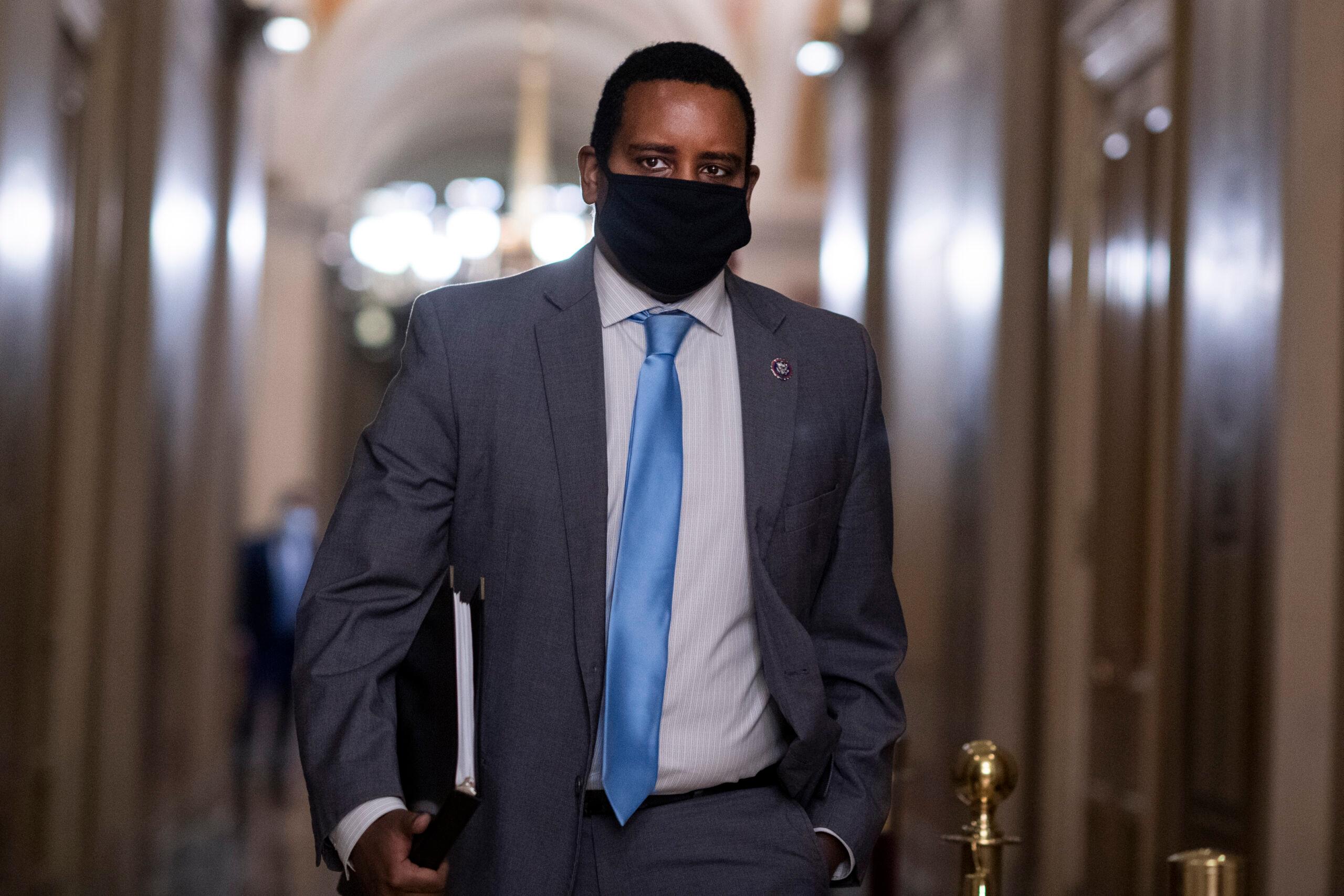 Rep. Joe Neguse, D-Colo., walks in the Capitol