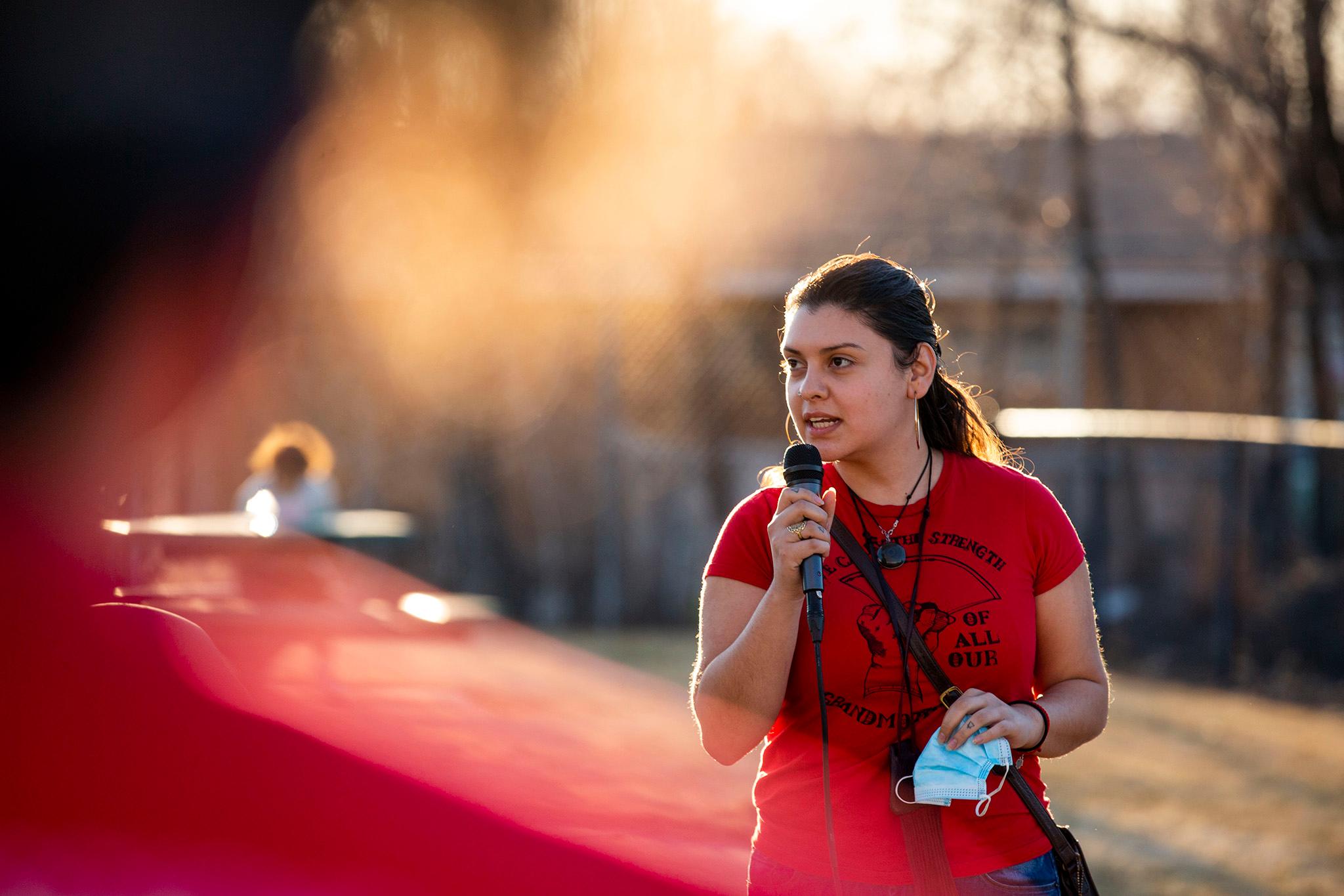 Aracely Navarro addresses acivists gathered at Adams Heights Park in Commerce City to demand accountability for pollution emanating from the Suncor refinery. March 6, 2021.