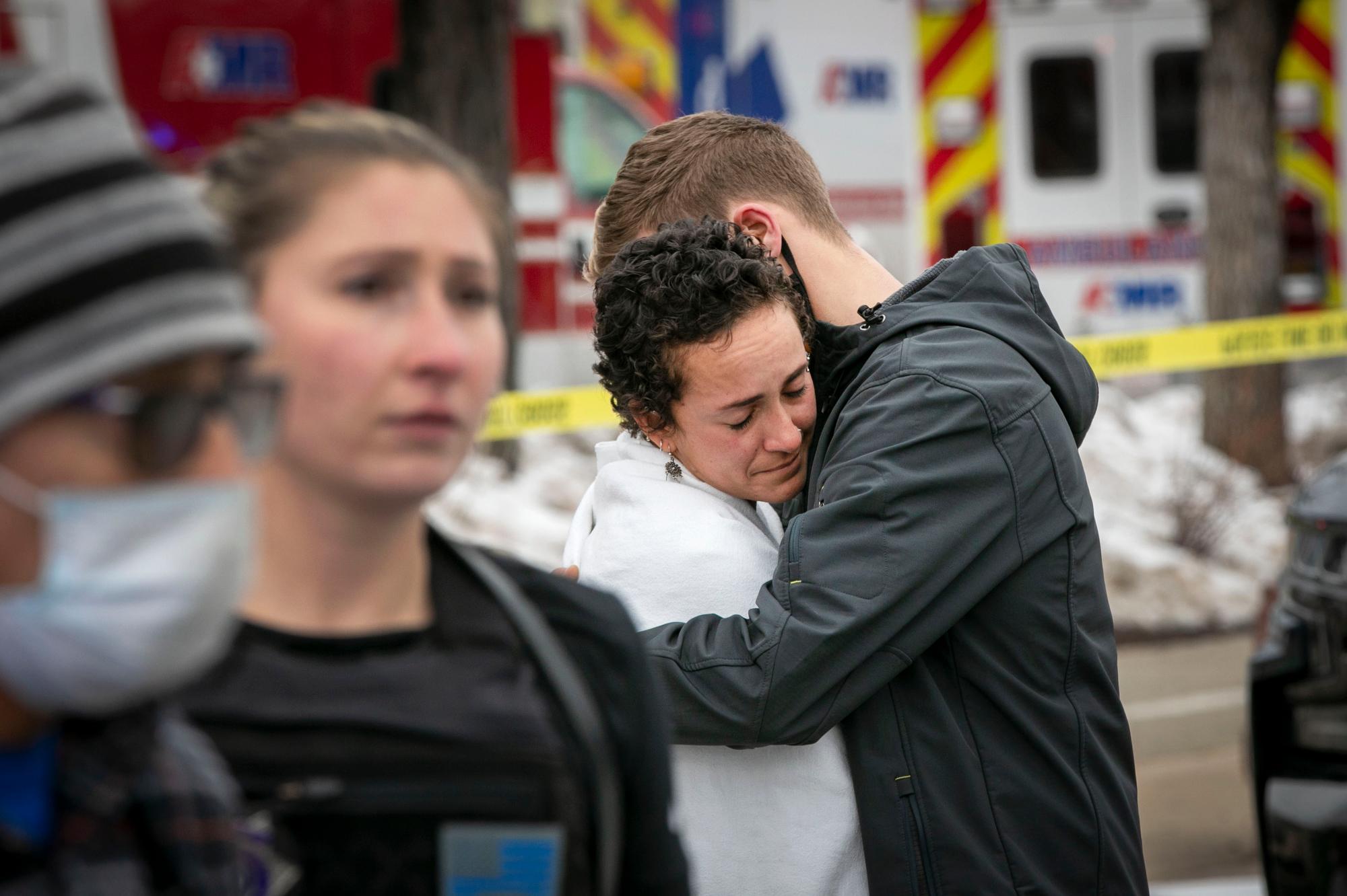 210323-BOULDER-KING-SOOPERS-SHOOTING-EMBRACE