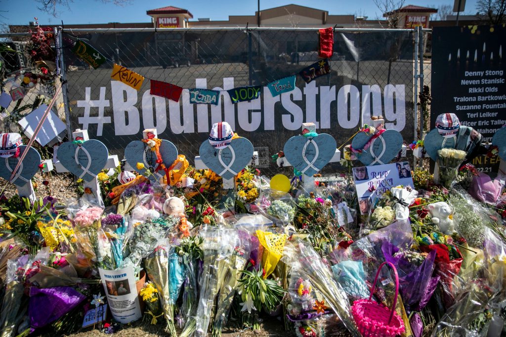 210329-BOULDER-SHOOTING-MEMORIAL-FLOWERS-SIGNS