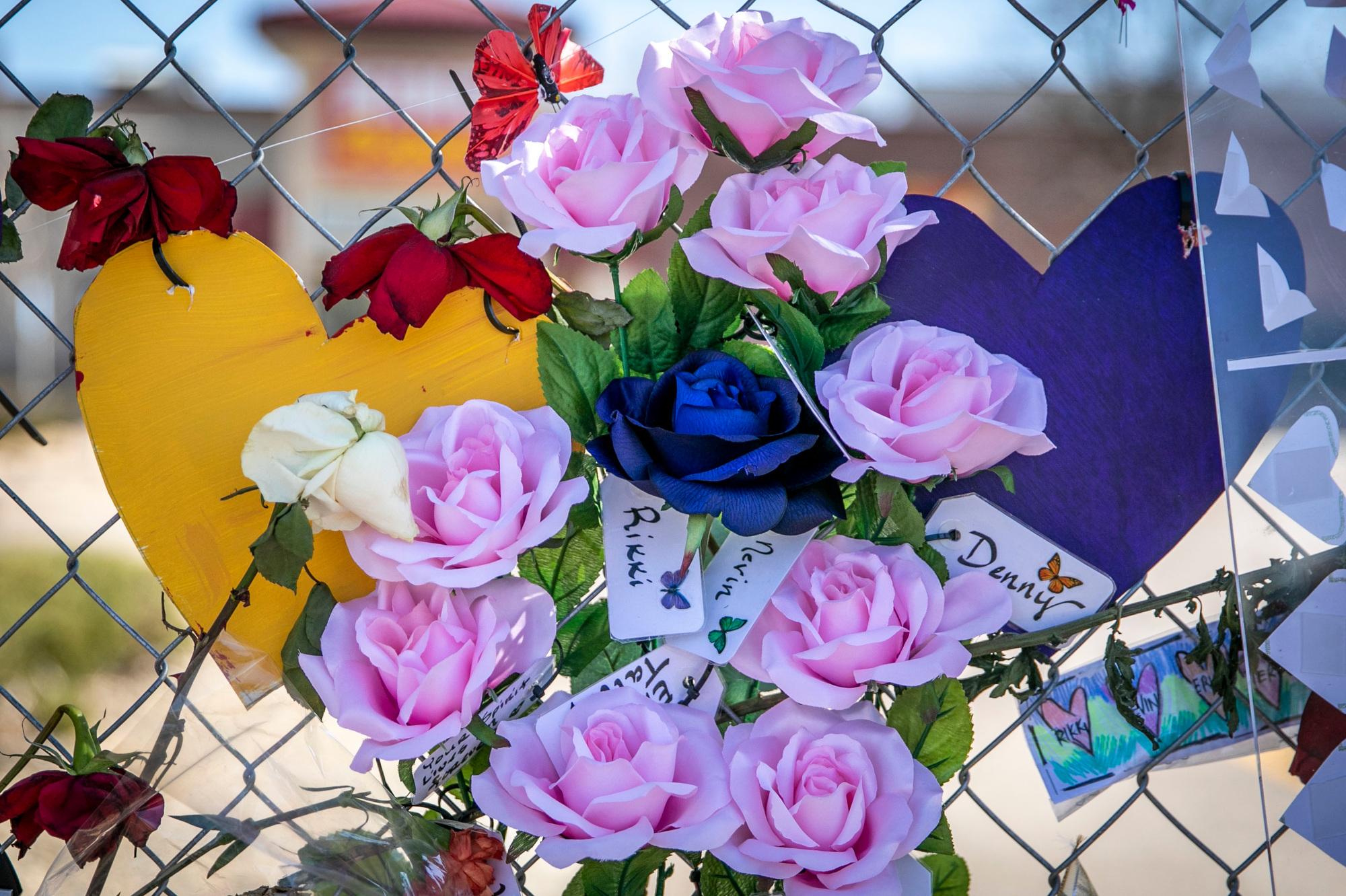 210329-BOULDER-SHOOTING-MEMORIAL-FLOWERS-SIGNS