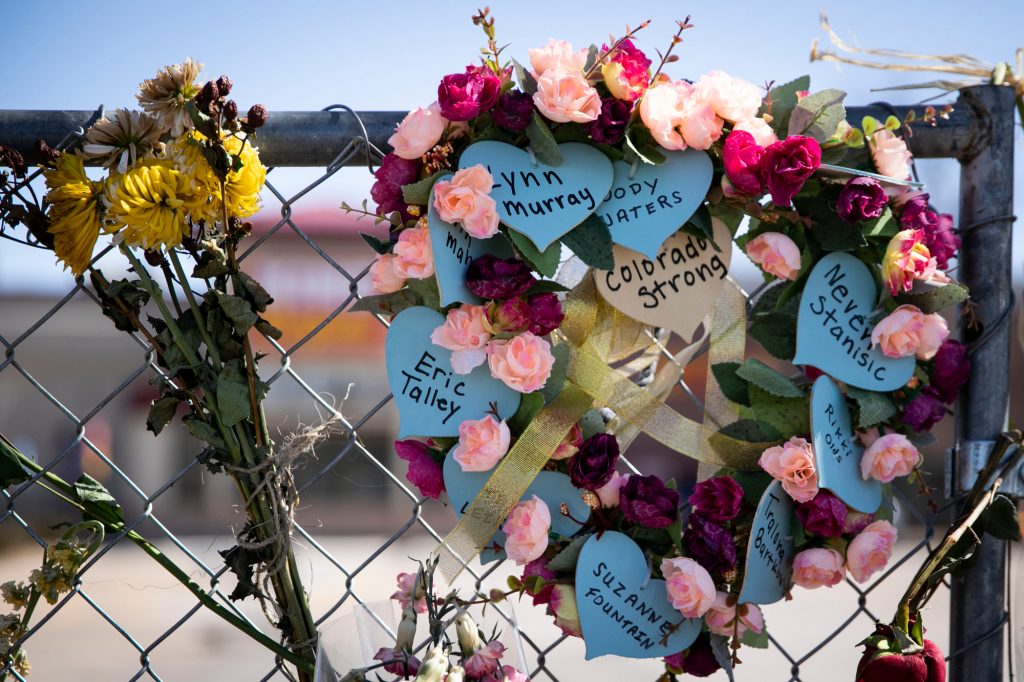 210329-BOULDER-SHOOTING-MEMORIAL-FLOWERS-SIGNS