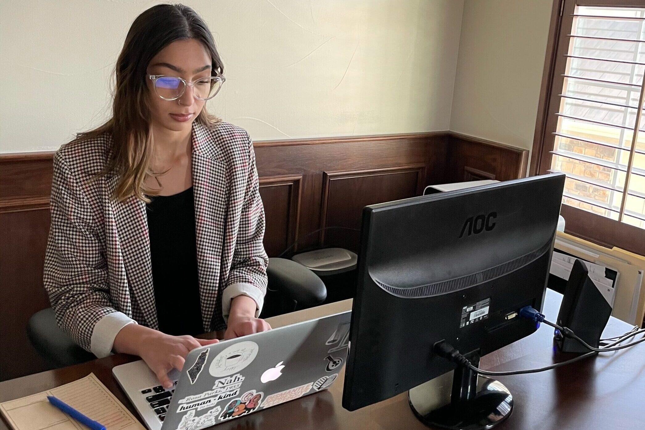 Ayah Ziyadeh, a former Colorado legislative aide, working at home in Aurora in 2021.