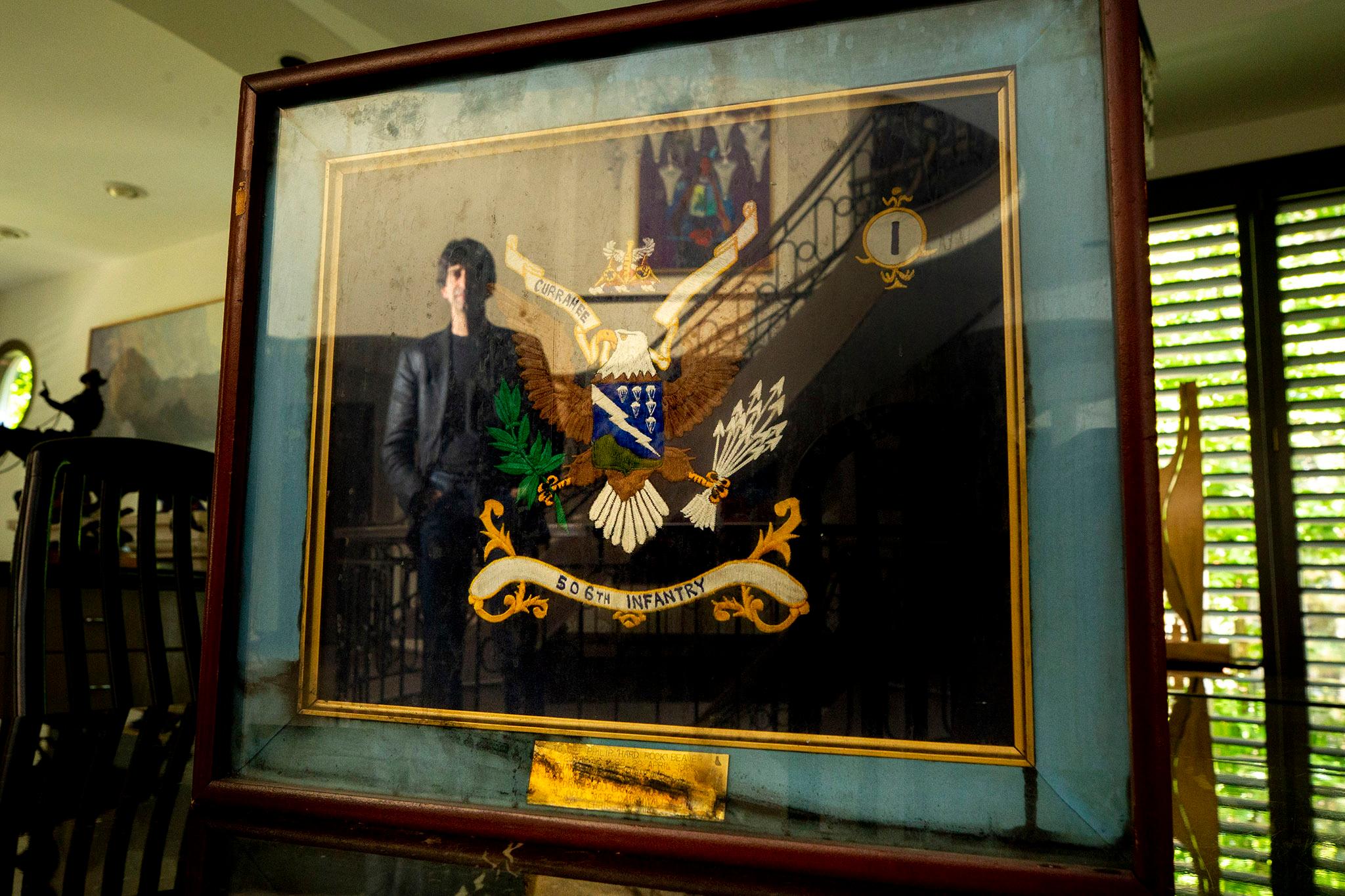 Philip Beaver's infantry colors were framed and hung in his office at the Pentagon when a plane struck the building on Sept. 11, 2001. He still has the frame, uncleaned after smoke and water marred it that day. Sept. 7, 2021.