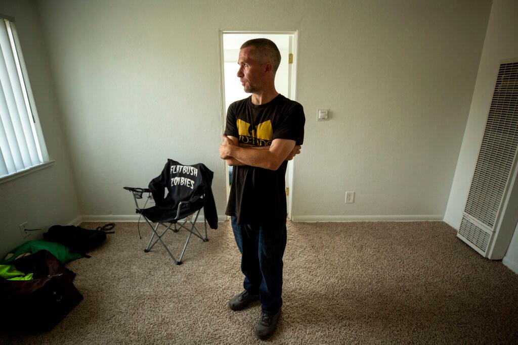 Jonathan Severs stands in his new apartment in Lakewood. Oct. 1, 2021.