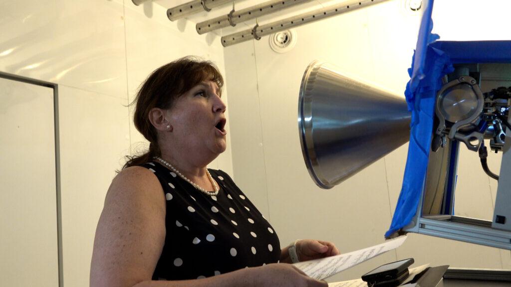 Mary Hughes, a performer with the NY Metropolitan Opera, participated in the CSU aerosol emissions study. Researchers used an aerosol testing chamber and optical particle counter, which uses a powerful laser, to measure respiratory particles released by singing and playing instruments.