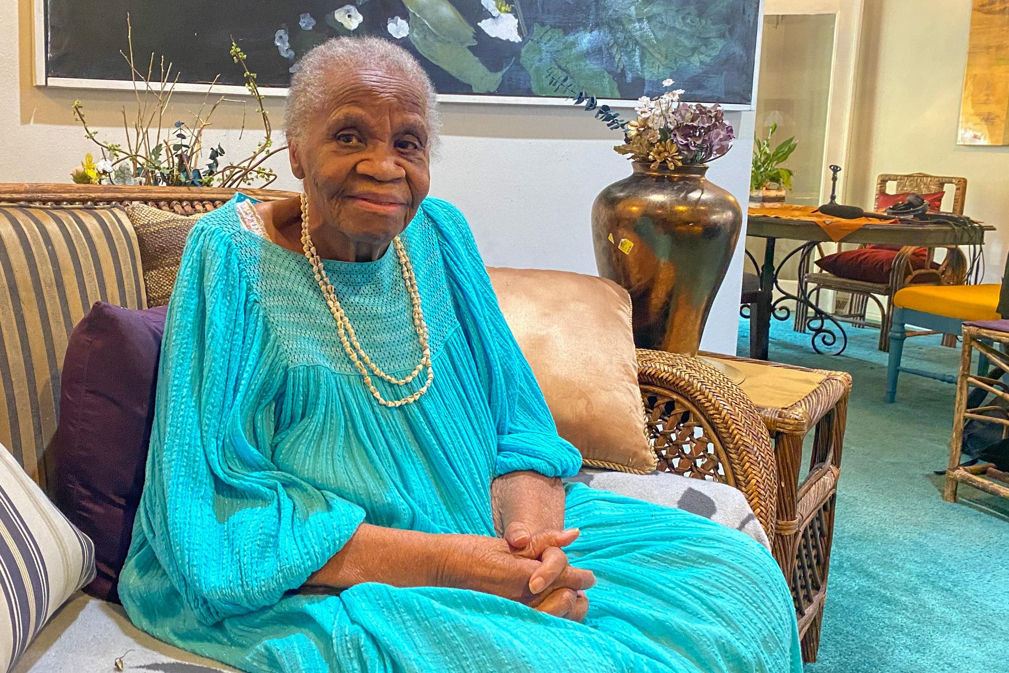 Historian Gwen Scott, pictured here at her Denver home, is the author of a book called "Blacks Through the 'Ayes' of Our American Presidents," from several years ago.
