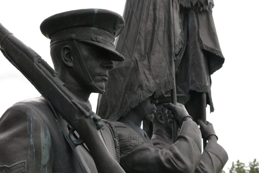 Statues of an Air Force color guard watch over the U.S. Air Force Academy Cemetery on Friday, May 27, 2022.