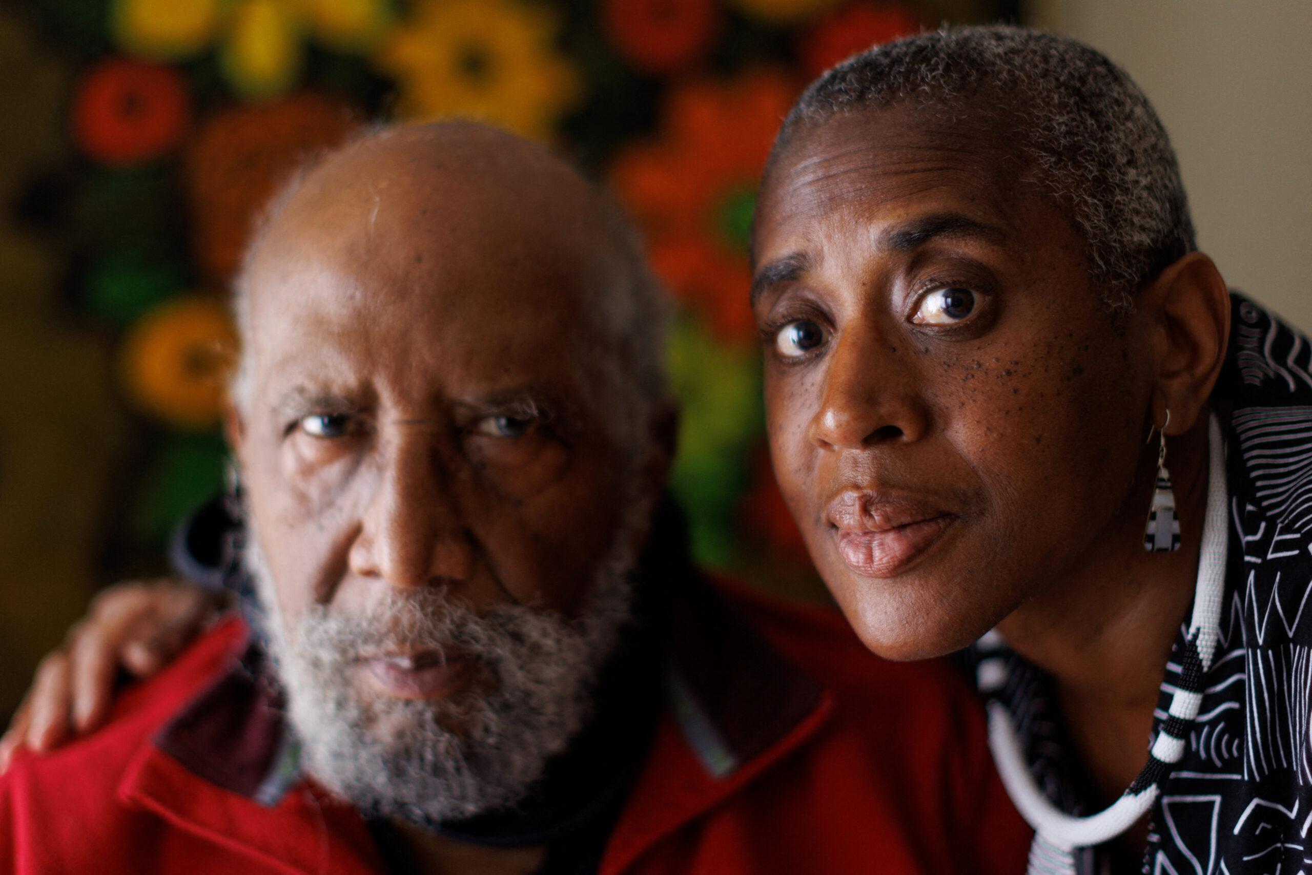 Reuters journalist Donna Bryson poses for a portrait with her 86-year old father Andrew