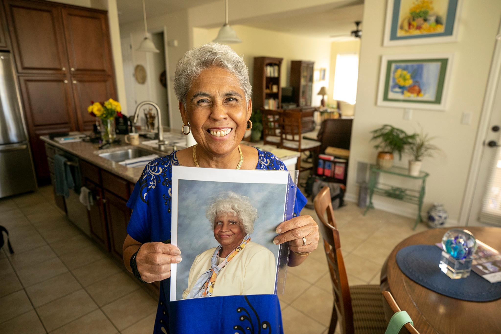 Judge Dianne Briscoe holds a photo of her mother, Ruth C. Denny. Aug. 24, 2023.
