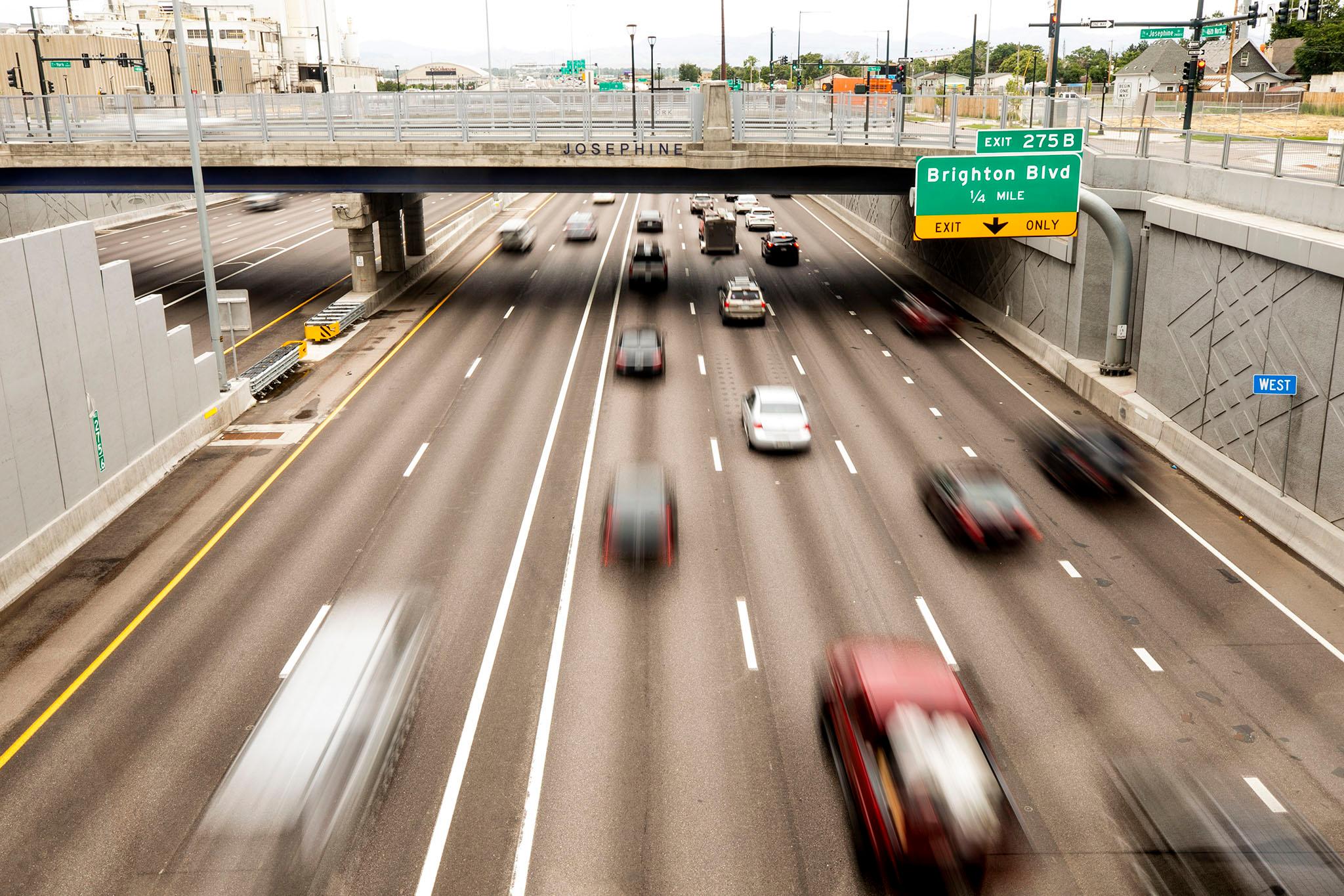 Drivers head westbound on I-70, seen from the Elyria Swansea park built above the highway. June 30, 2023.