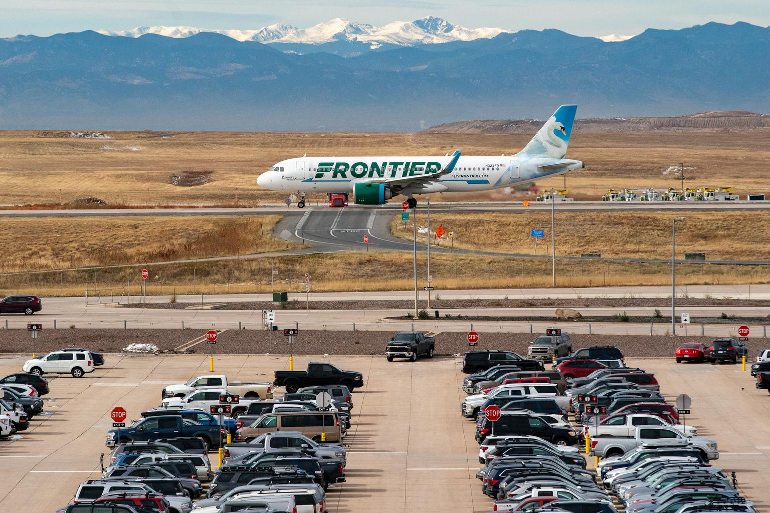 DIA AIRPORT JET, PARKED CARS