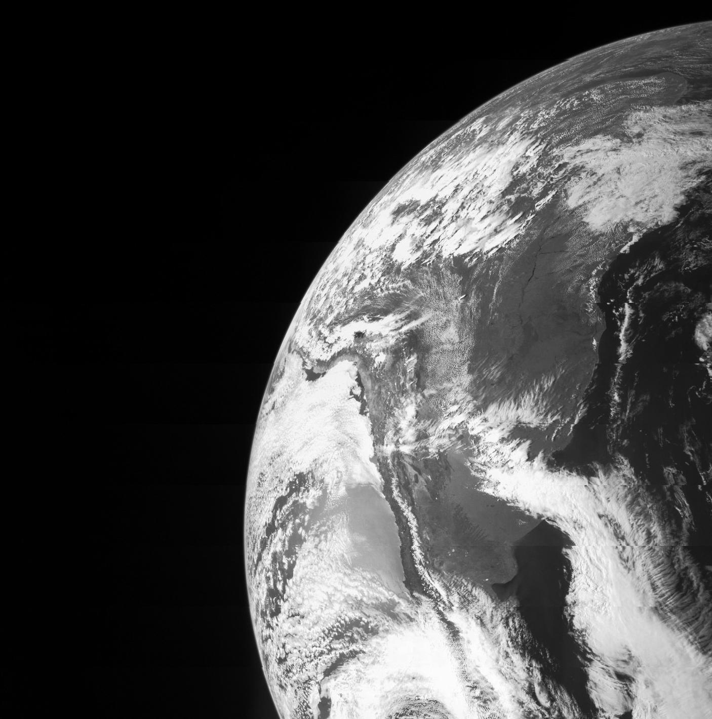 On Oct. 9, NASA's Juno spacecraft flew past Earth, using our home planet's gravity to get the final boost it needed to reach Jupiter. The JunoCam instrument captured this monochrome view of Earth.